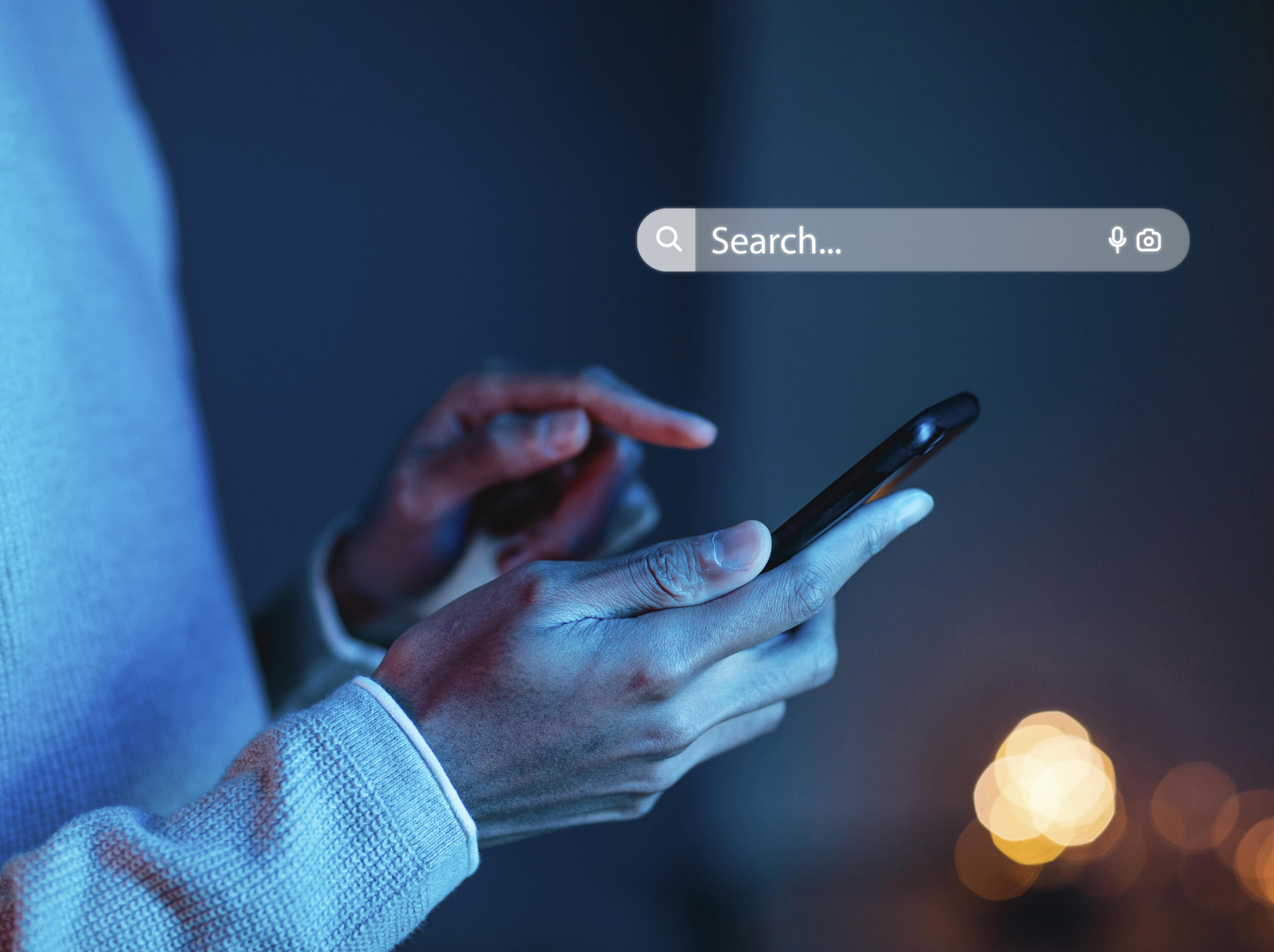 Hands holding a phone searching AI